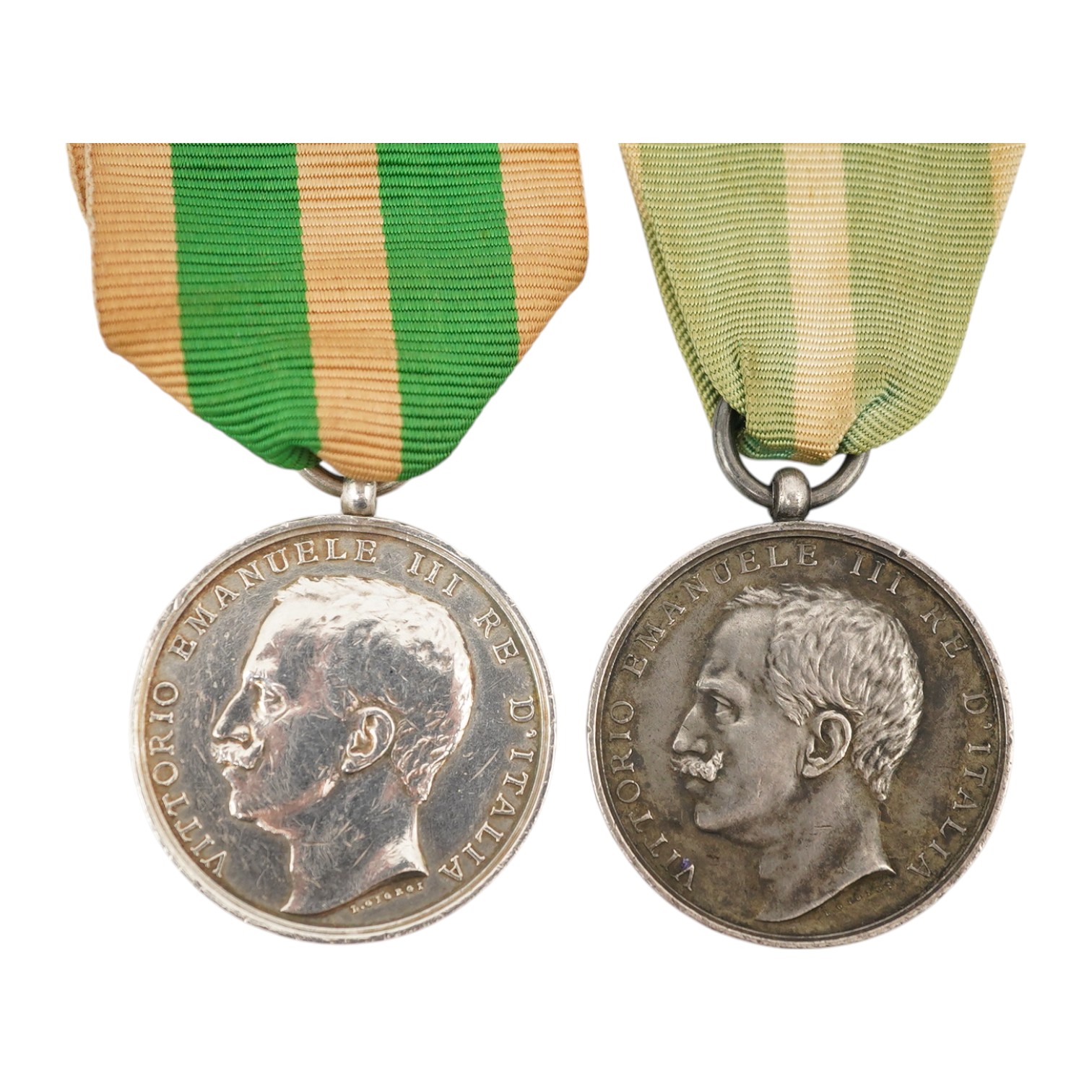 A cased Italy, Kingdom. Messina Earthquake Medal 1908, awarded to J. Stringer? (Worn), A.B. 18254 H.M.S. Bacchante, together with another uncashed example, unnamed, (2). Condition - fair.